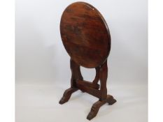 A 20thC. stained hardwood tilt top table, 24in dia