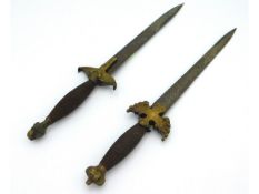 A pair of 20thC. continental daggers stamped Toled