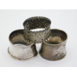 Three silver napkin rings, Birmingham 1909; London