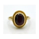 A 9ct gold ring with garnet, 2.7g, size M