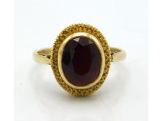 A 9ct gold ring with garnet, 2.7g, size M