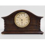 An eight day mantle clock, 10.75in wide x 6.25in h