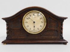 An eight day mantle clock, 10.75in wide x 6.25in h