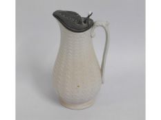 A Victorian water jug with pewter top, 9.5in tall