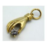 A 9ct gold hand pendant with paste stone, 22mm lon
