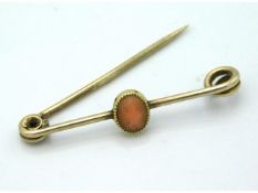 A yellow metal 19thC. brooch set with striped oran