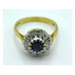 An 18ct gold ring with illusion set diamond & cent