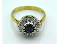 An 18ct gold ring with illusion set diamond & cent