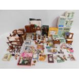 A quantity of dolls house furnishings including bo
