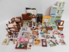 A quantity of dolls house furnishings including bo