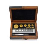 An antique cased apothecary weight set