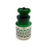 A 1904, Birmingham silver cased Crown Perfumery Company green perfume bottle. Stopper currently relu