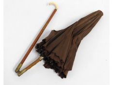 An early 20thC. ladies folding cane parasol with b