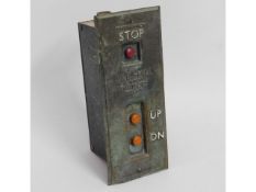 A bronze mounted lift button by J & E Hall, Dartfo