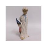 A Royal Dux figurine of boy, 5in tall