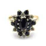 A 9ct gold sapphire & diamond cluster ring, 5g, si