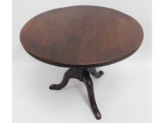 An antique oak circular pedestal table, 29.75in di