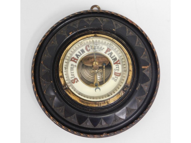 A carved hardwood Victorian barometer with enamell