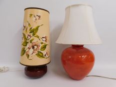 A retro lamp twinned with one other decorative cer