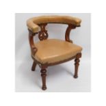 An antique captains chair, 30in high to back