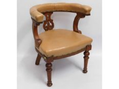 An antique captains chair, 30in high to back