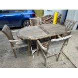 A teak garden table & four stacking chairs, 64in x