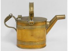 A five pint brass watering can after Christopher D