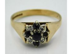 A 9ct gold diamond & sapphire ring, lacking one sa