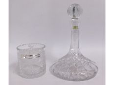 A cut glass crystal ships decanter twinned with a