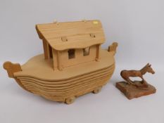 Wooden puzzle of Noah's Ark twinned with carved Bo