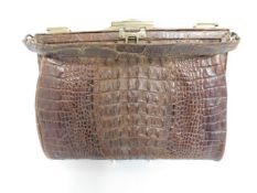 A suede lined ladies crocodile skin handbag, 10in