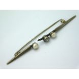 A white metal brooch set with pearl & 0.15ct of ol