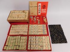 A boxed Mah-Jong set twinned with a box of Bakelit