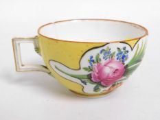 An 18th/19thC. yellow ground Meissen style cup, small chip & crack, 2in high, crossed swords & star