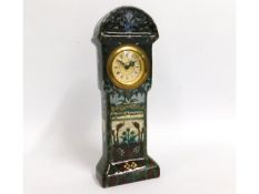 A decorative German faience clock, signed Dec: E.