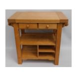 A compact, oak butchers block with drawers, 38.5in