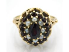 A 9ct gold garnet & pearl cluster ring, 4.7g, size