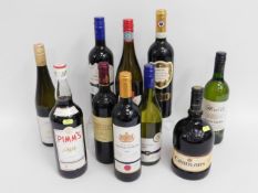 A quantity of mixed alcoholic beverages including four bottles of white & red wine each twinned with