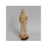 A small 19thC. plaster figure of religious interes