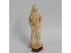 A small 19thC. plaster figure of religious interes