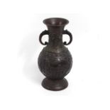 A Chinese relief bronze style vase with figures &