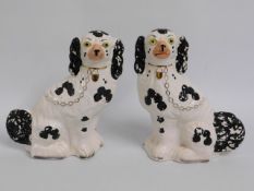 A pair of Staffordshire style mantle sheepdogs, 12