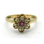 A 9ct gold ring daisy style ring set with approx.