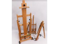 A large artist easel & two others