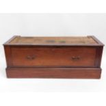 An Edwardian mahogany wardrobe base with drawer, c