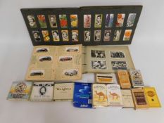 A quantity of vintage cigarette boxes & cigarette