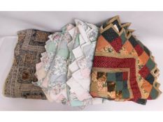Four vintage bedspreads, three of patchwork style