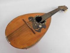 A Japanese Suzuki mandolin with mother of pearl in