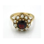 A 9ct gold garnet & pearl ring, size L, 3.4g