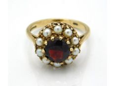A 9ct gold garnet & pearl ring, size L, 3.4g